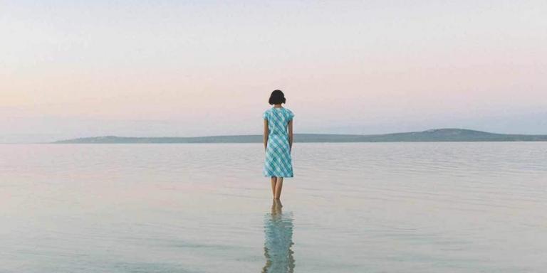 a woman walking alone and feeling depressed