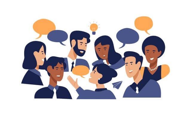 A variety of people chatting to each other.